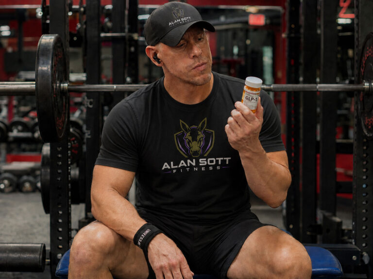 Man at gym holding a bottle of GLP-1s.