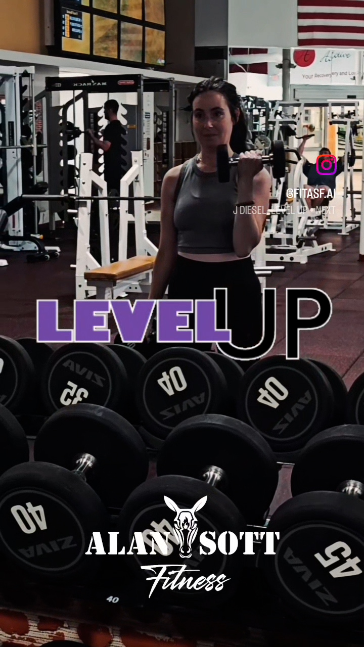 Young woman in her 30s weight training with her personal trainer.